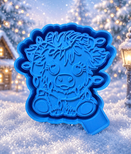 Highland cow with Christmas lights wrapped around